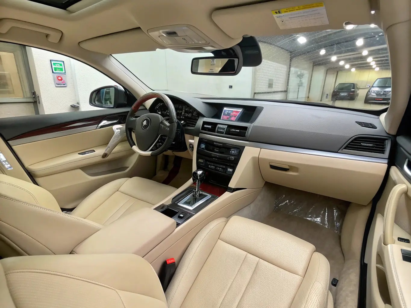 An interior shot of a car being thoroughly cleaned, with attention to detail on the seats, dashboard, and carpets. The image should convey cleanliness and freshness.