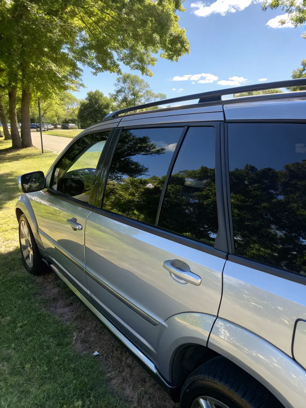 A car with professionally tinted windows, demonstrating the sleek appearance and privacy benefits. The image highlights the quality of the tint and its seamless integration with the vehicle's design.